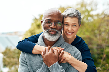 Portrait, hug and senior couple with love, interracial and marriage with happiness, bonding and...