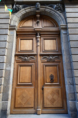 Old ornate door seen in Saint Malo - typical old apartment buildiing.