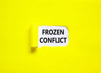 Frozen conflict symbol. Concept words Frozen conflict on beautiful white paper. Beautiful yellow table yellow background. Business and Frozen conflict concept. Copy space.