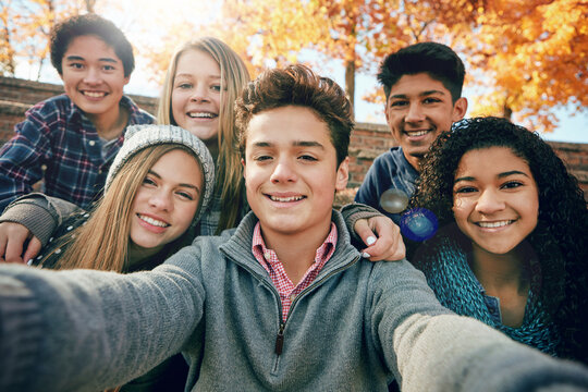 Friends, teenager and group selfie in the park, nature or fall trees and teens smile, picture of friendship and happiness for social media. Portrait, face and happy people together for autumn photo
