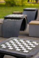 Empty chessboard in the park. People play chess in outdoors in the park.