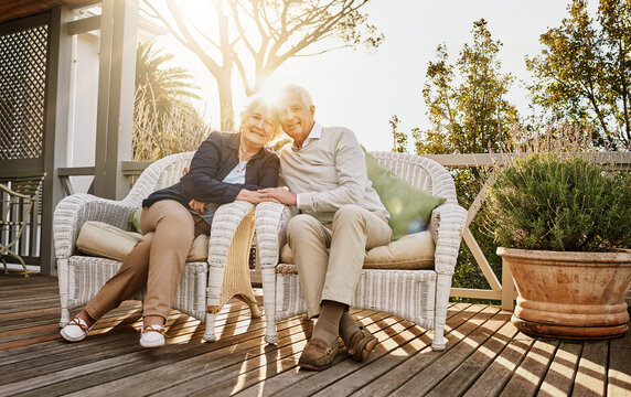 Love, patio and portrait of senior couple with sunrise enjoying bonding, quality time and relax in morning. Marriage, retirement home and elderly man and woman smile with drink for breakfast on deck