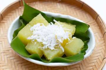 Steamed tapioca cake or cassava cake with grated coconut