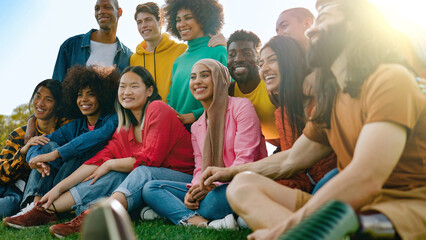 Multiracial group of friends having fun outdoor during summer vacations - Diversity lifestyle concept - Focus on Asian girl face