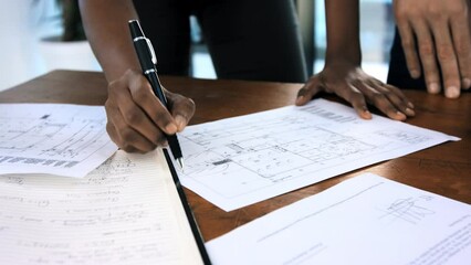 Planning, blueprint and review with hands for architecture for engineering, project management or construction design. Writing, strategy or creative with designer and floor plan or collaboration idea