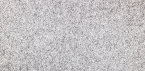 Light gray felt with a natural texture. Fabric surface texture, banner.