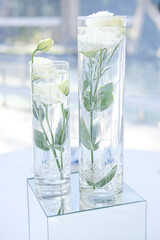 delicate  watercolor roses in an elegant vas