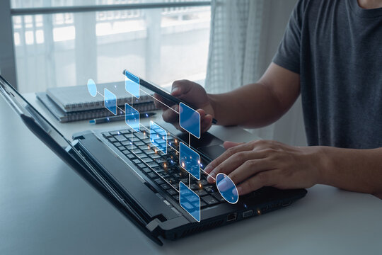 Businessman using a computer analysis for process and workflow automation with flowchart, Businessman or engineer working on business process automation or algorithm.