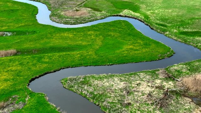 Top view of small river Lyna flowing in Warmia, northern Poland, Europe