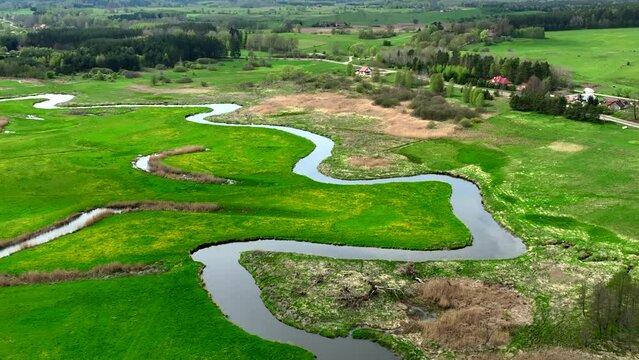 Top view of small river Lyna flowing in Warmia, northern Poland, Europe