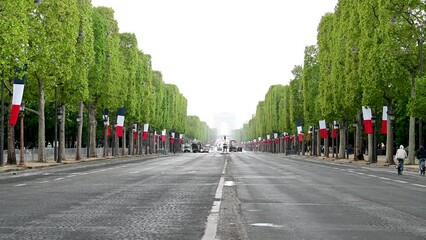 Paris, France: The Avenue des Champs-Elysees. Streets of Paris. Arc de Triomphe in distance. 