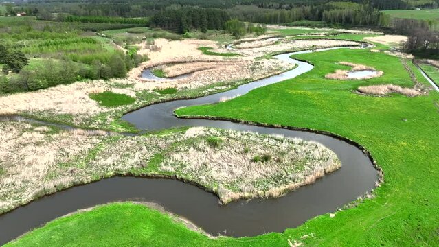 Top view of small river Lyna flowing in Warmia, northern Poland, Europe