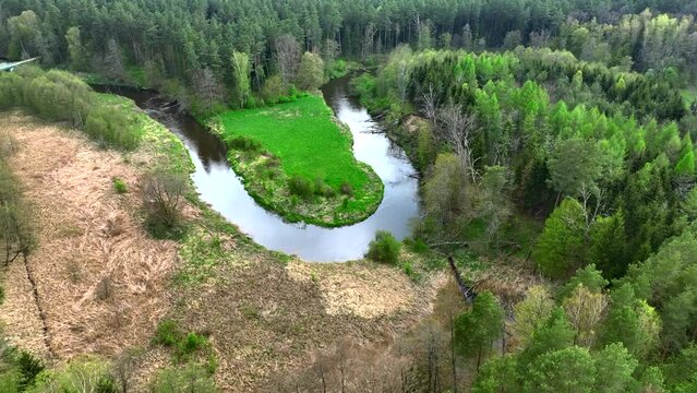 Top view of small river Lyna flowing in Warmia, northern Poland, Europe