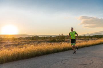 Obraz premium Triathlete in professional gear running early in the morning, preparing for a marathon, dedication to sport and readiness to take on the challenges of a marathon. 