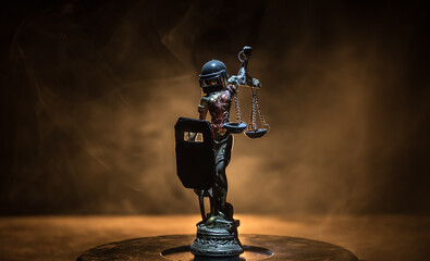 No law or dictatorship concept. The Statue of Justice with anti-riot police helmet holding scale....