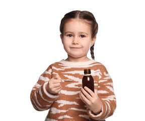 Cute girl holding bottle and measuring spoon with cough syrup on white background. Effective...