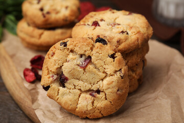 Cookies with freeze dried fruits on wooden table, closeup