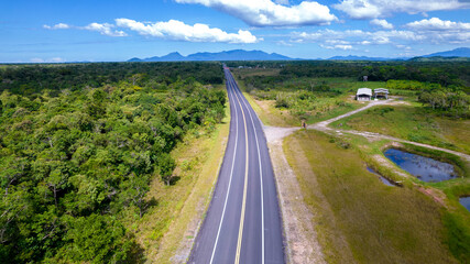 Fototapeta na wymiar Aerial view of the road in the city of Cananéia. Highway in Pariquera Açu
