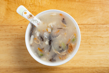 top view shredded fish soup with carrot slices and black fungus