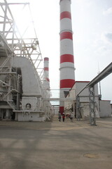 A powerful thermal power plant provides heat and electricity to the whole city.