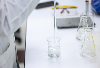 Acid-base reaction titration in Laboratory.