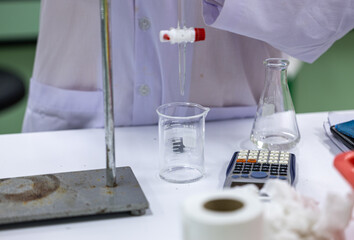 Acid-base reaction titration in Laboratory.