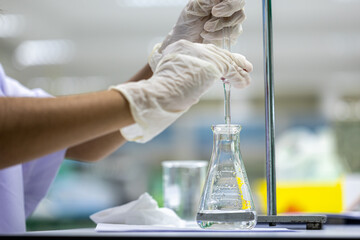 Acid-base reaction titration in Laboratory.