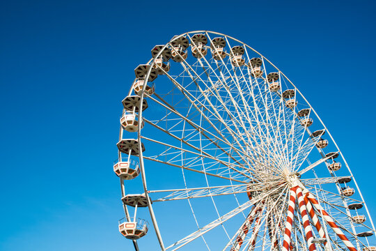 Big ferris wheel against a blue summer sky