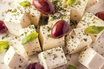 Greek cheese feta with oregano and olives.