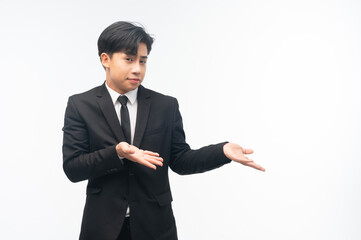 handsome businessman holding hand presenting product empty copy space standing over isolated white background.