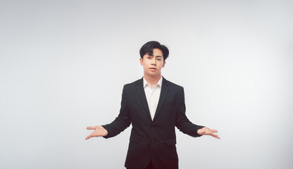 handsome businessman holding hand presenting product empty copy space standing over isolated white background.