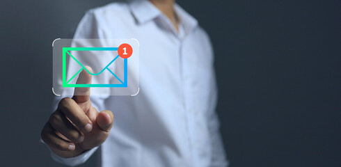 Businessman in white shirt is receiving and opening emails or messages via virtual screen. Concept of online business contact.