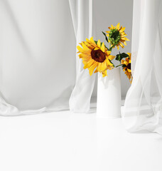 Empty white counter table, soft, smooth blowing sheer fabric curtain drapery, yellow sunflower in ceramic vase in sunlight for luxury cosmetic, skincare, beauty, fashion product display background 3D