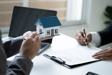 Close up Real Estate agent explain signing agreement for buying house. Bank manager and real estate concept.