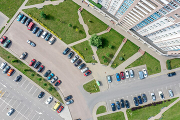 aerial top view of outdoor parking lot near new residential house. drone photo looking down. © Mr Twister