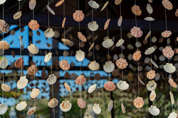 Scallop shells on fishing lines. Bay House on an island near Nha Trang in Vietnam. Tourist...