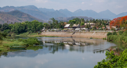 Fototapeta na wymiar The Nam Khan River as it flows through Luang Prabang in northern Laos