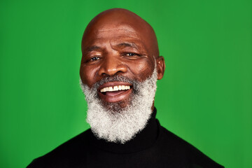 Happy, smile and portrait of black man on green screen for confident, fashion and elegant. Happiness, style and senior with face of male model isolated on studio background for pride and beard mockup