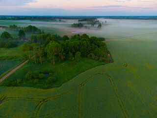 Mystical Sunrise Drone View of Lush Green Landscape of Northern Europe