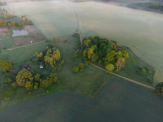 Mystical Sunrise Drone View of Lush Green Landscape of Northern Europe
