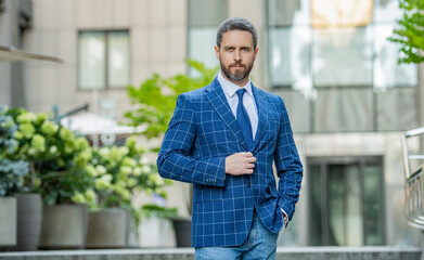 professional business boss on urban background. business boss wearing jacket