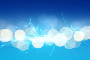 Abstract background of light blue shades with glare and bokeh effect.