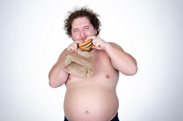 Diet and healthy lifestyle. Funny fat man eating a burger.	