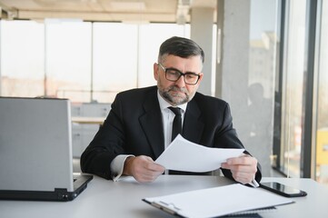 Fototapeta premium Angry businessman with too much work in office