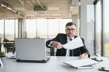 Angry boss shouting at his employee