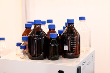 empty glass reagent bottles in chemical laboratory