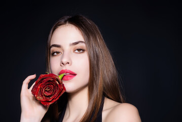 Beauty girl with red rose. Beautiful sensual woman hold flowers, studio portrait.