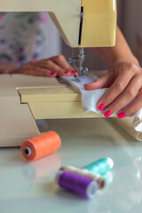 Young Female Seamstress Working at Home