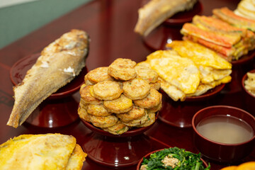 prepare food for ancestral rites table	