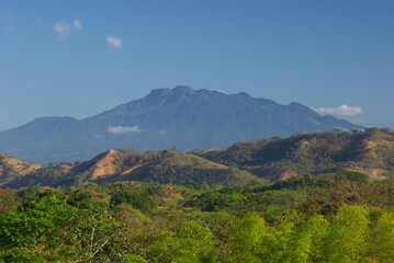 Fototapeta na wymiar Chiriqui, Panama landscape with Volcan Baru, the tallest mountain and only active volcano in Panama, shown in the background on a sunny day.